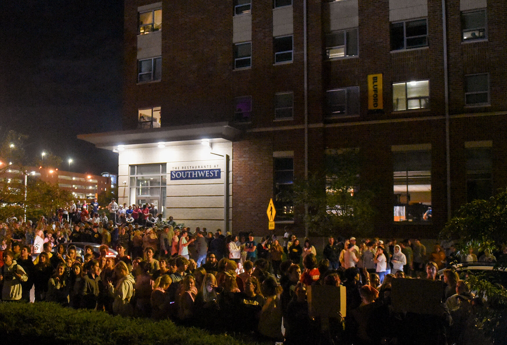 MU students stand outside Phi Gamma Delta hours after university officials announced the suspension of fraternity events